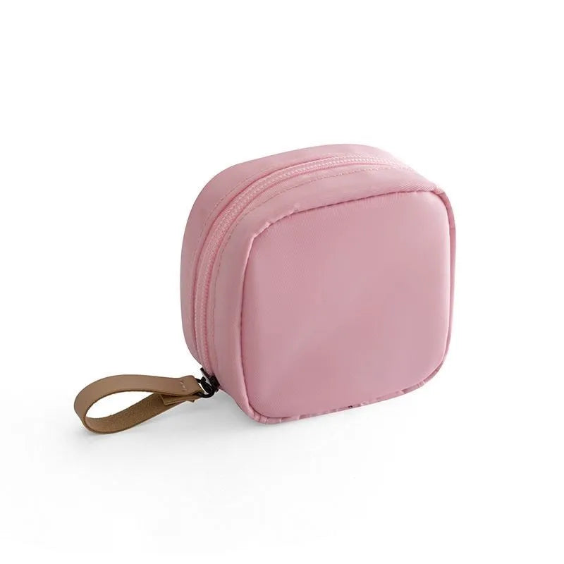 Cloth cube-shaped makeup storage bag in plain design available in multiple colours