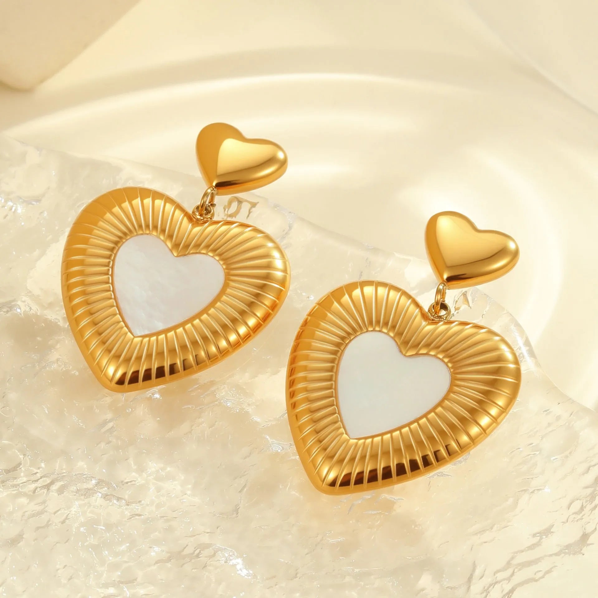 Stainless steel heart shape earrings with fritillary pattern and gold electroplating