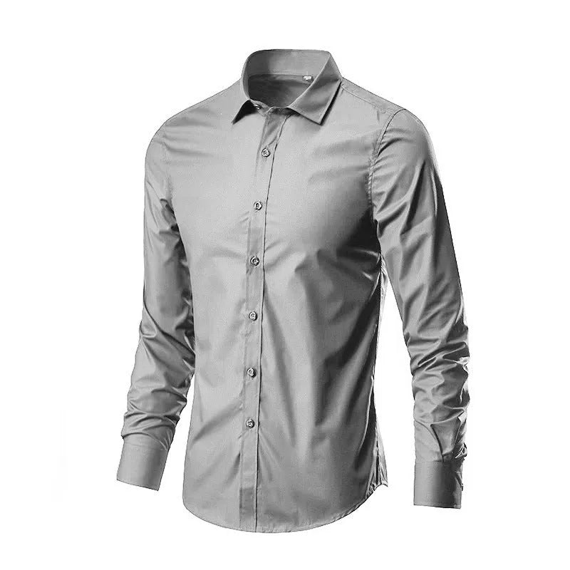 Man wearing a loose-fit linen long sleeve shirt in a neutral colour, showing the slim profile and button front.