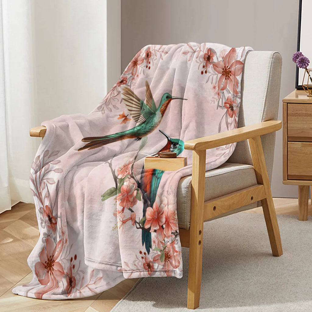 Pink hummingbird floral flannel velvet fleece throw blanket on sofa