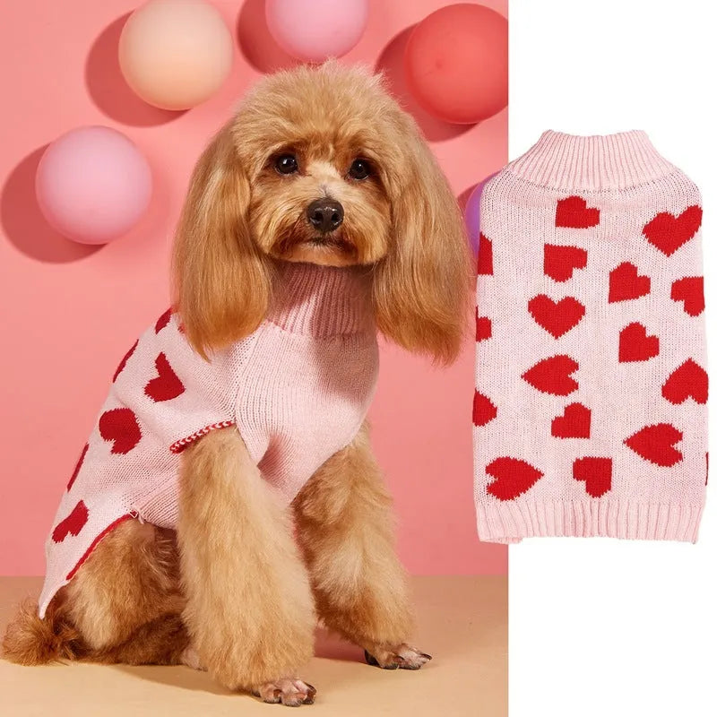 Red love heart design dog sweater on a small dog, showing acrylic knit fabric and playful motif.