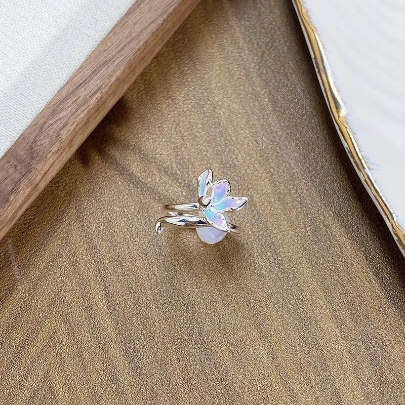 Copper adjustable insect ring with dripping oil finish in jewellery display
