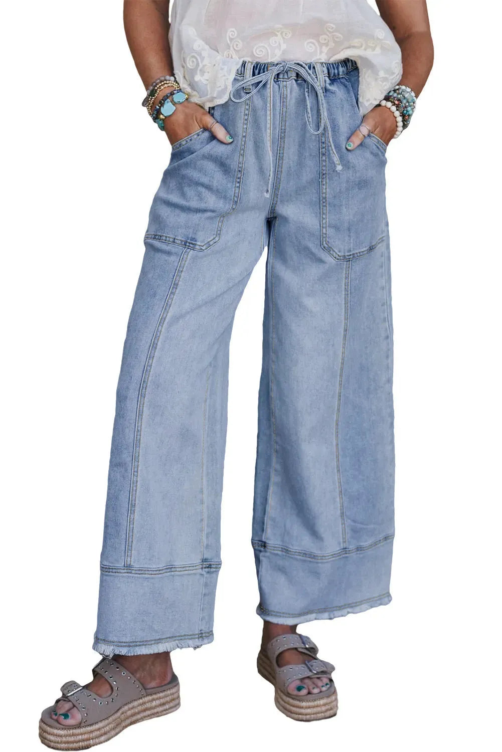 Beau Blue wide leg denim pants with drawstring waist and raw hem detailing laid flat