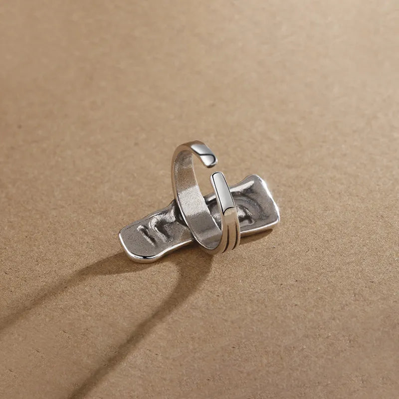 Copper retro half face mask ring with electroplated finish and adjustable opening on a neutral background.