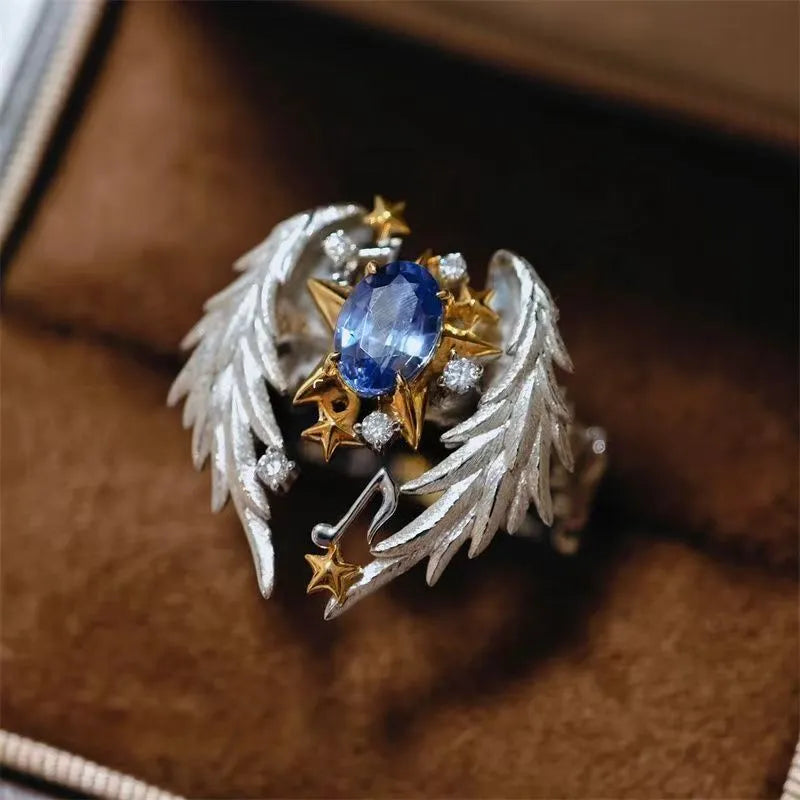 Adjustable angel wings ring with geometric design and open mouth construction