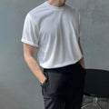 Men's slim fit cotton t-shirt in solid white colour showing round neck and half-length sleeves