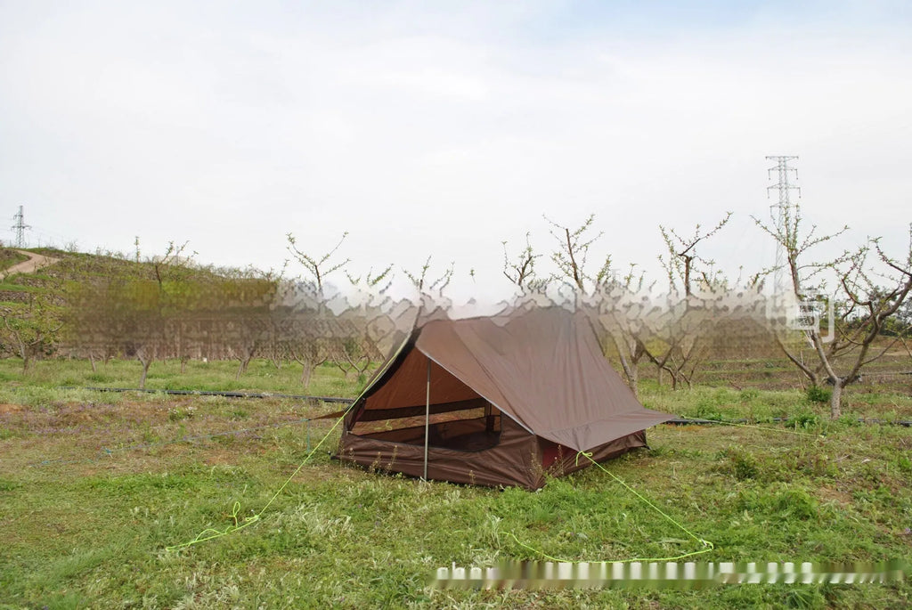 Brown A-line pole-free portable tent with hiking cane support showing interior space for 2-3 people