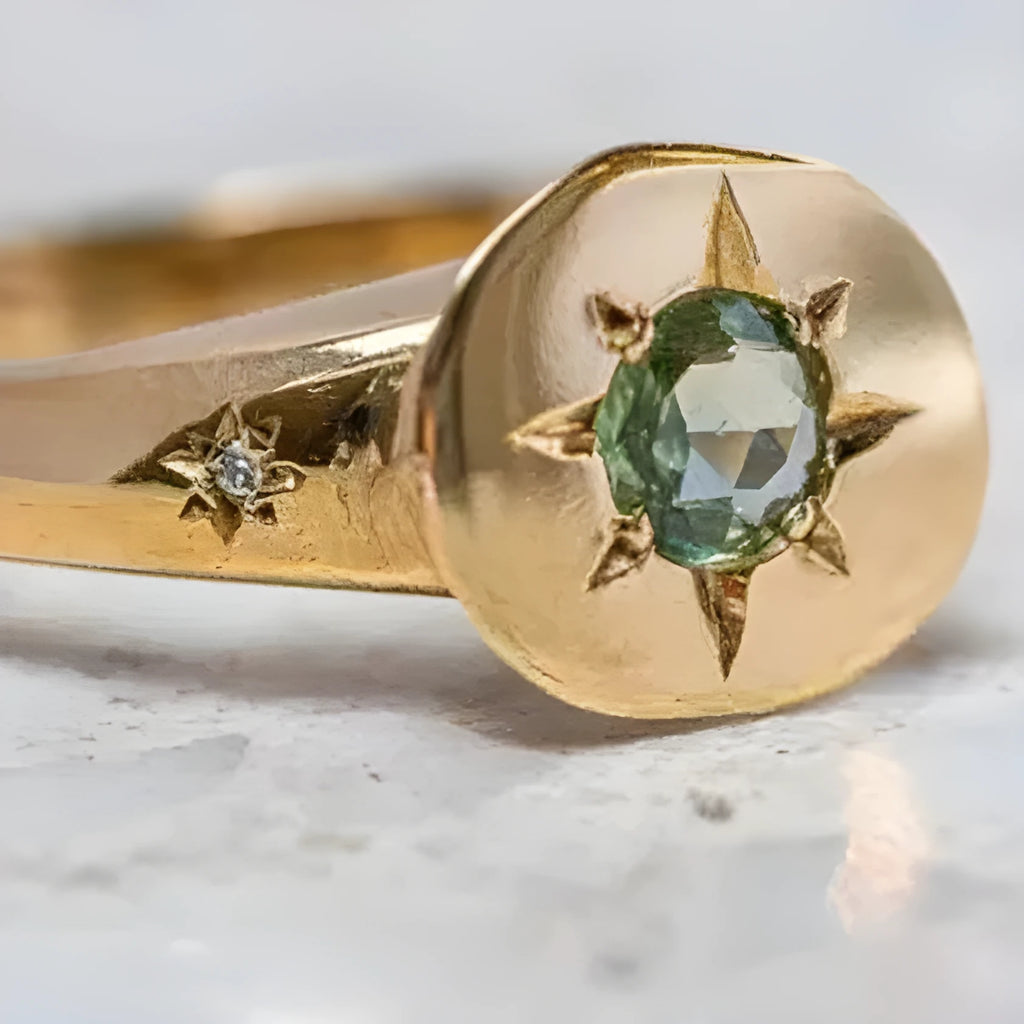 Golden oval ring with star asterism design and adjustable opening mechanism