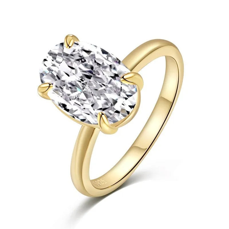 Oval women's silver ring with four-claw setting and cold luxury finish in gold or silver colours