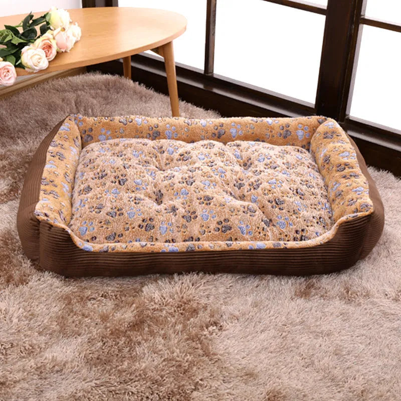 Camel coloured plush dog bed with sofa-style bolsters for small dogs, shown in Large 70x55cm size