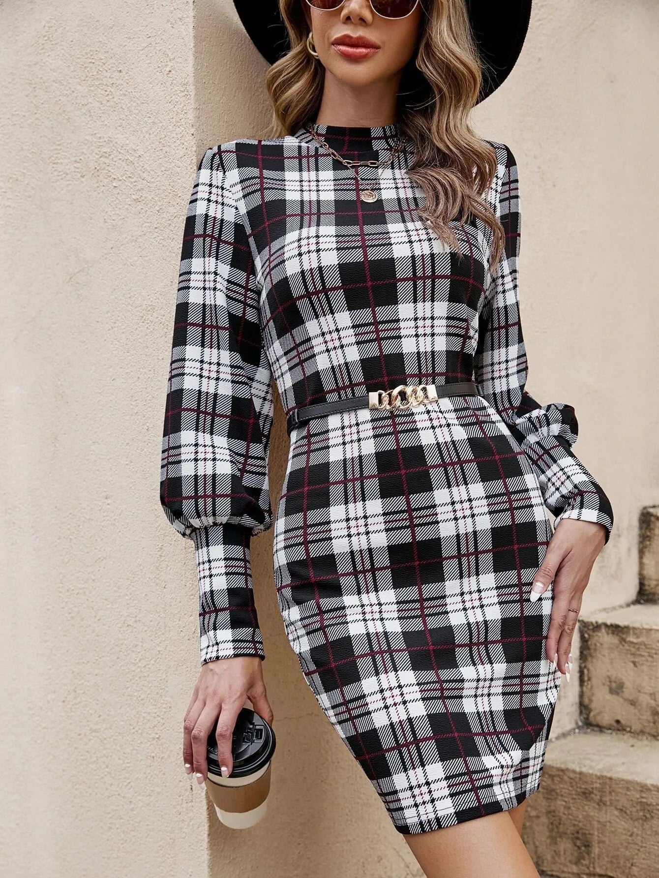 Black tight-fitting midi dress with voluminous lantern sleeves and leather stitching detail