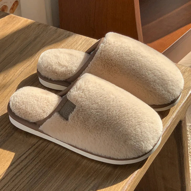 Winter plush slippers in solid colours with non-slip PVC soles and car stitching detail