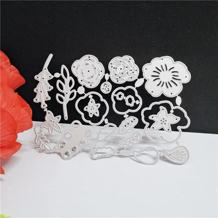 Silver carbon steel craft die with etched flower design for paper cutting, measuring 14.3 by 9.9 cm.