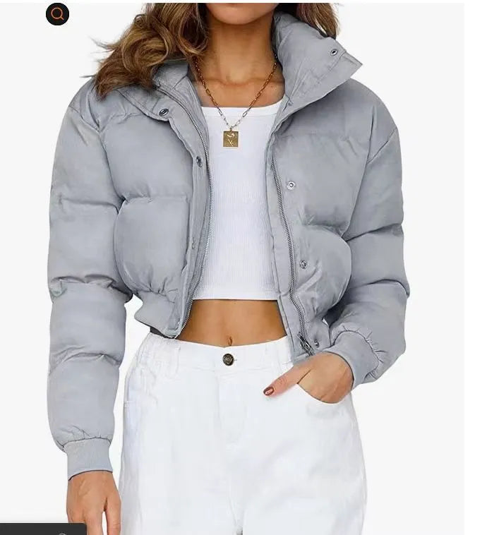 Women's loose fit blue polyester jacket with long sleeves on hanger