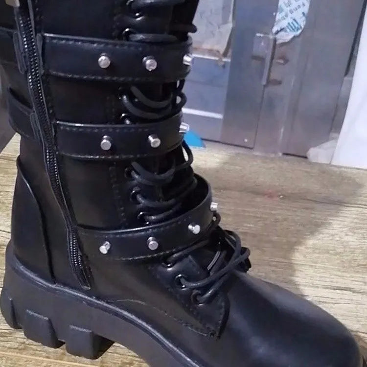 Women's black mid-calf knight boots with a metal buckle strap and side zipper.