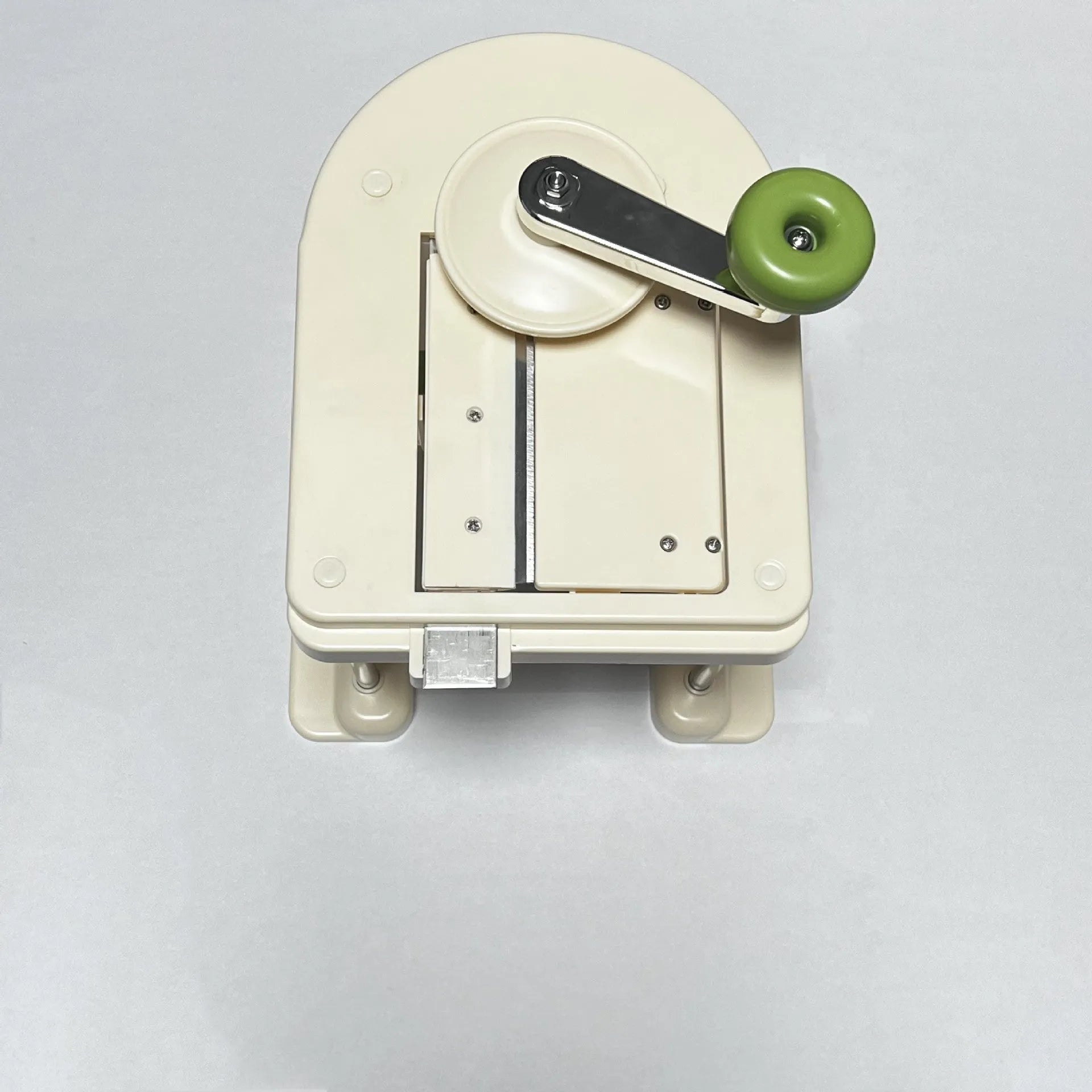 Beige kitchen vegetable slicer grater with stainless steel blades for spiralising and shredding