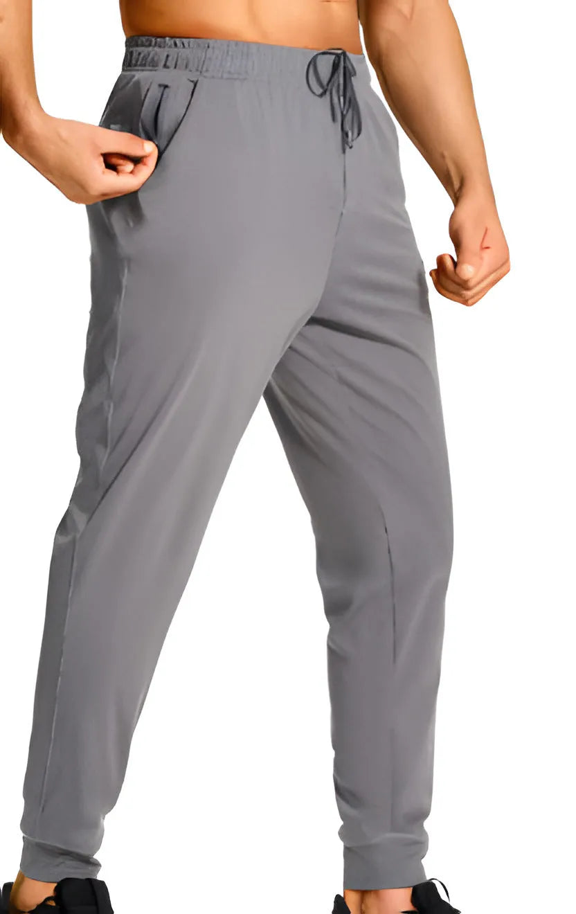 Men's loose fit casual trousers in solid colours with polyester fabric construction