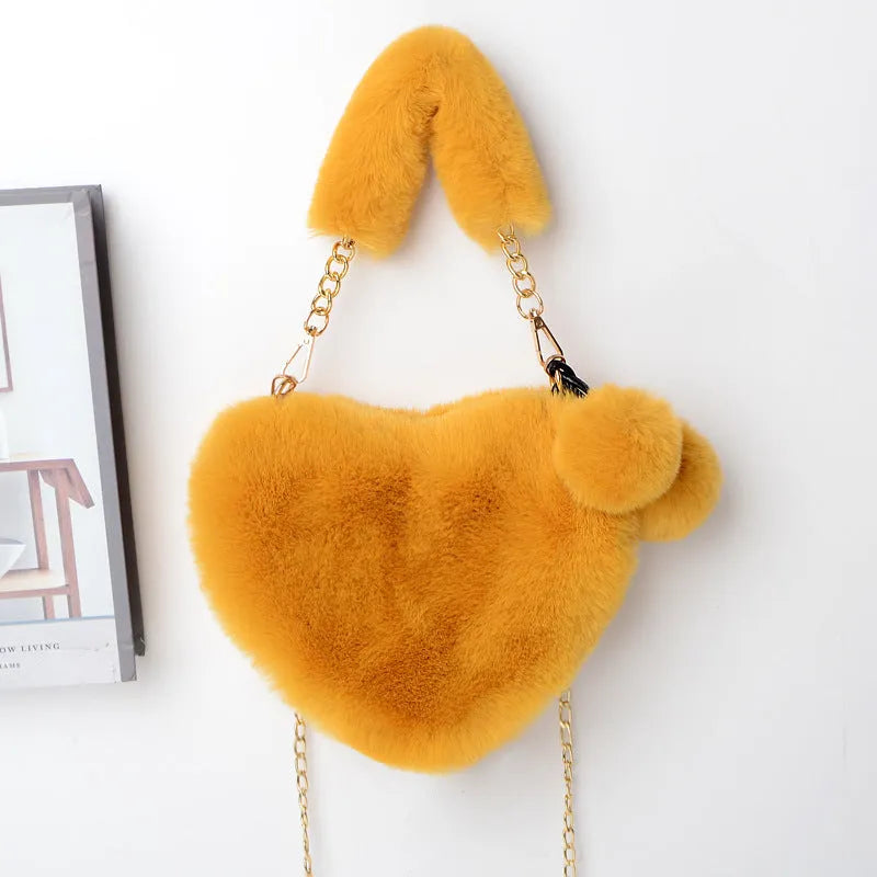 Soft plush heart-shaped women's handbag in medium size with zipper closure