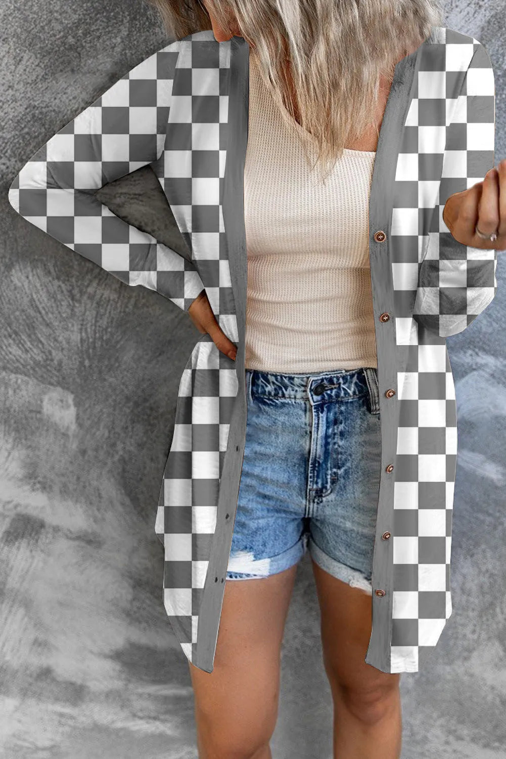 Women's long grey plaid knitted coat cardigan with contrasting colour blocks, loose fit, and regular sleeves.