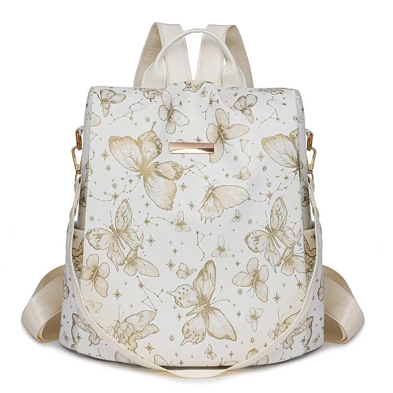 Butterfly printed PU backpack in multiple colours showing sewing line detail and curved backplate
