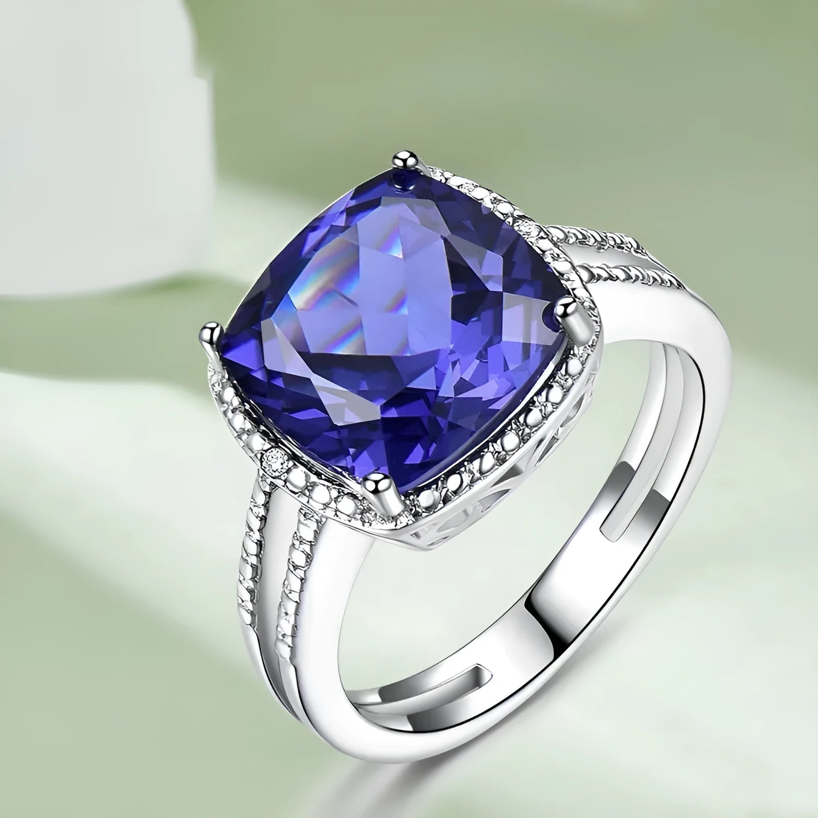Women's sterling silver ring with a blue Tanzanite gemstone, shown in UK size options 6 to 10.