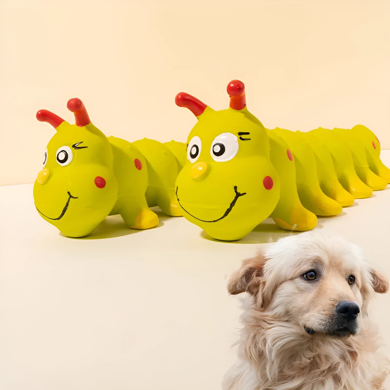Yellow rubber caterpillar-shaped squeaky toy for dogs, shown next to a tape measure indicating 25.5cm length.