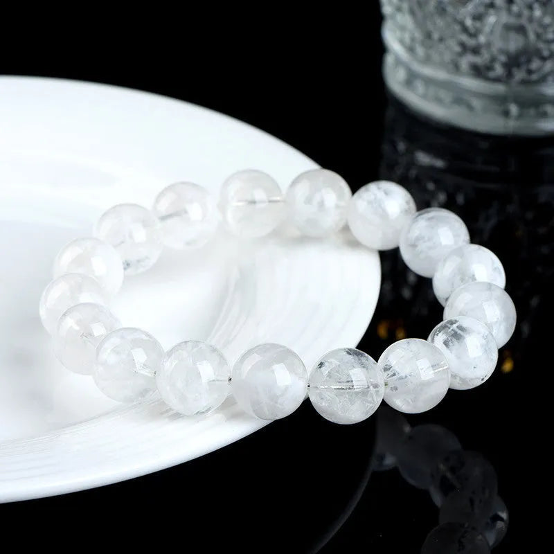 Women's crystal bracelet with round blizzard snowflake beads and geometric Ruyi Xiangyun design.