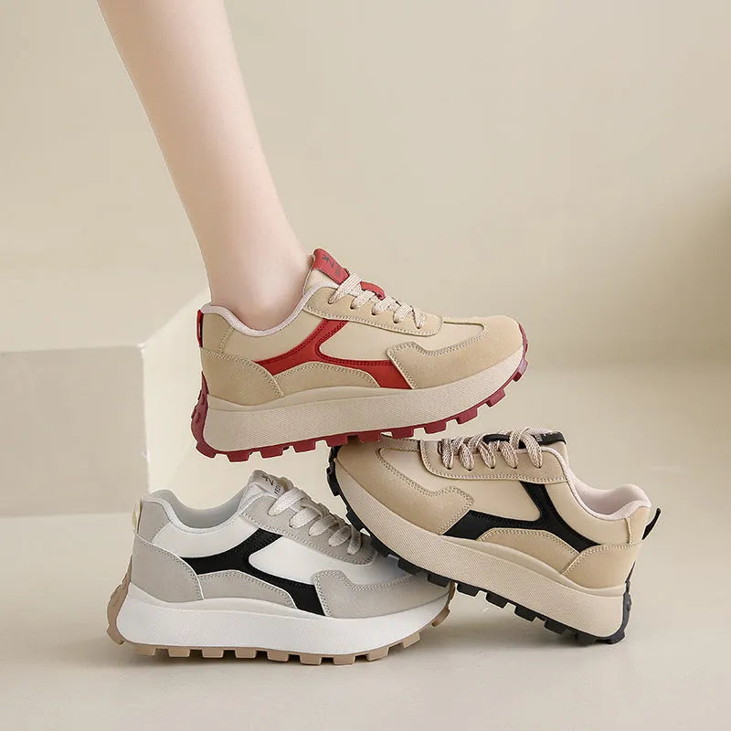 Women's solid-colour platform sneakers with mesh upper and flat rubber sole.