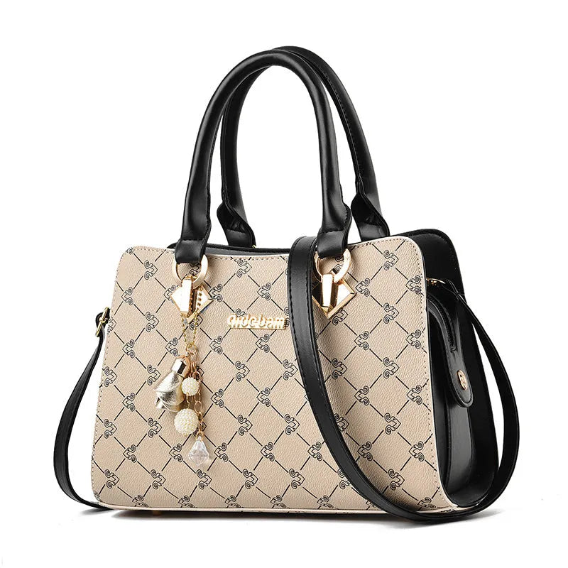 Women's geometric print messenger bag in PU material with internal organisation pockets and zipper closure