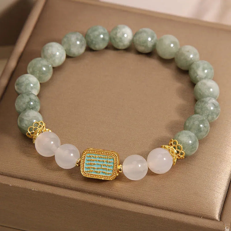 Women's oil green emerald crystal bracelet with five scriptures design on white background
