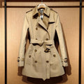 Women's khaki trench coat with double-breasted front and flight sleeves