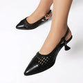 Gold women's sandals with a cat heel, buckle strap, and rubber sole.