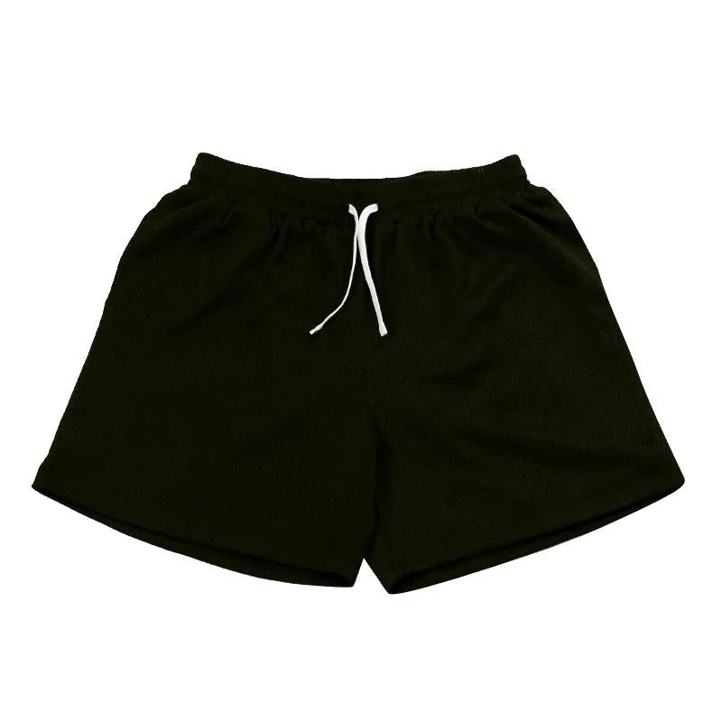 Men's mesh quick-drying shorts in solid colours for running and fitness.