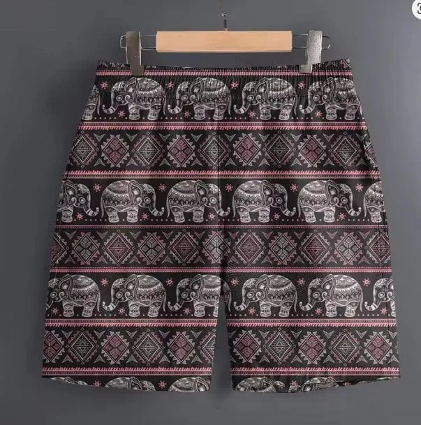 Men's casual polyester shorts in camouflage pattern, laid flat showing waistband and leg.