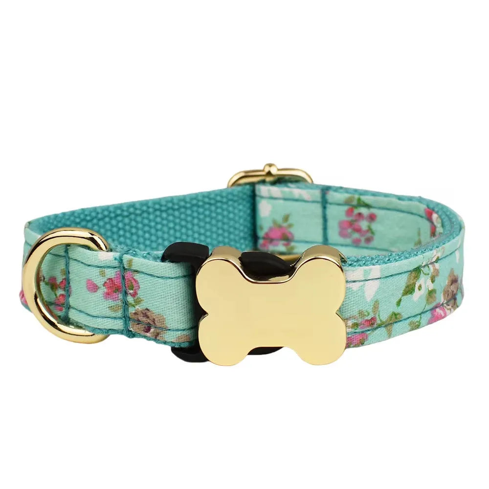 Flat nylon dog collar with a printed grid pattern and a silver bone-shaped metal buckle on a white background.