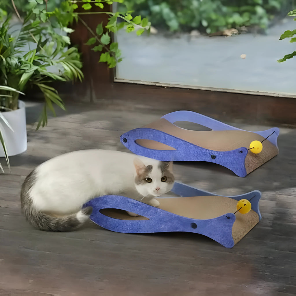 Blue fish-shaped cat scratcher with cardboard lounge area and hanging ball toys