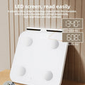 White professional body fat scale with tempered glass platform and 8 electrodes for body composition measurement