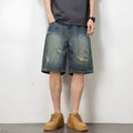Retro blue denim men's shorts with loose hole details and straight leg.