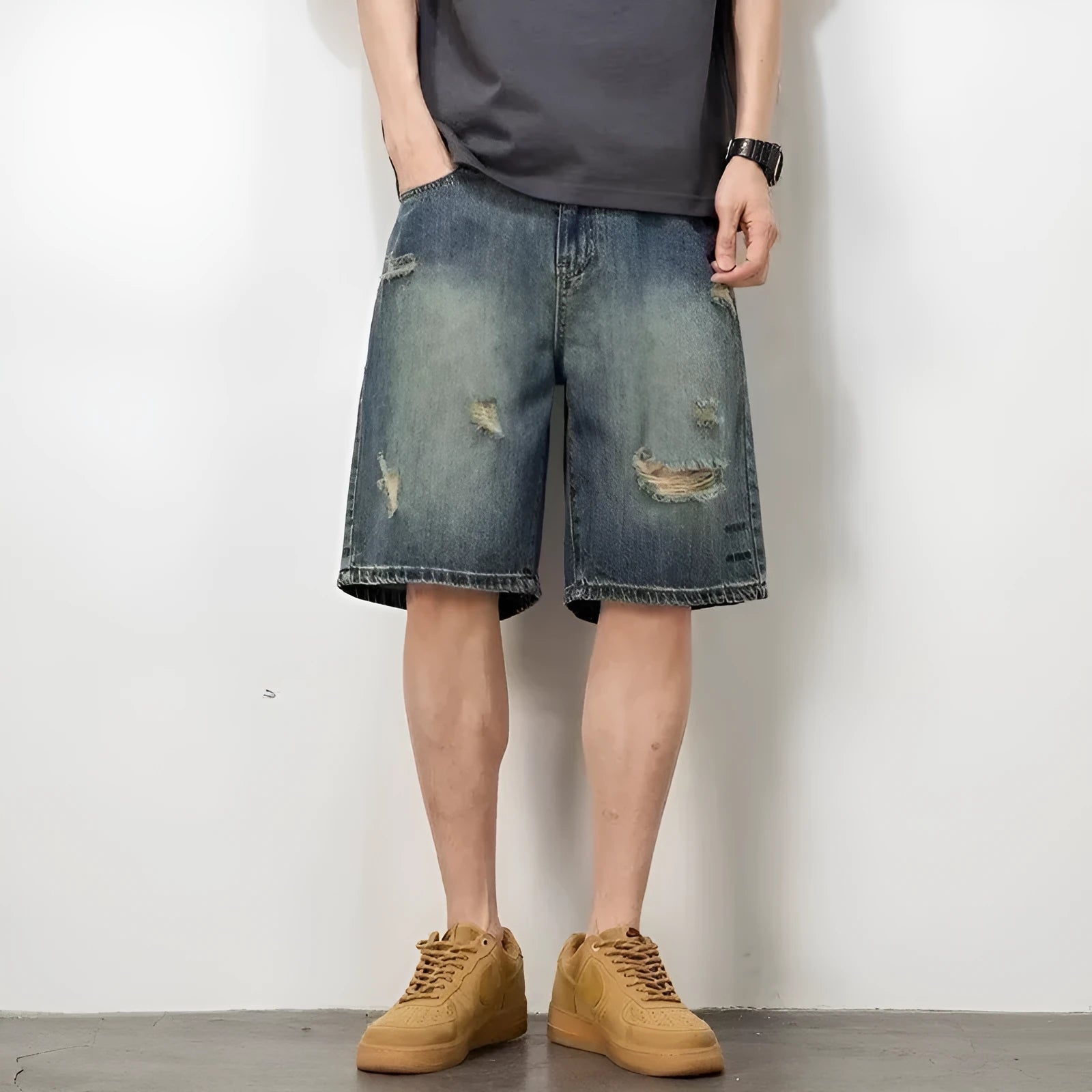 Retro blue denim men's shorts with loose hole details and straight leg.