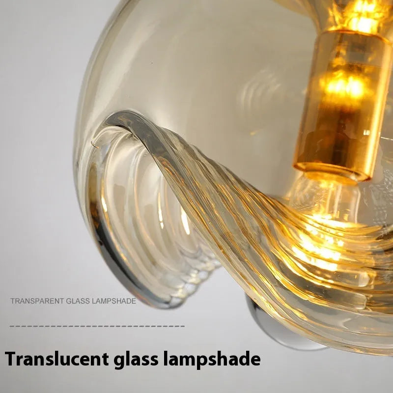 Modern minimalist glass bedside chandelier with 250mm diameter, shown in transparent, amber, and smoky grey colour options.