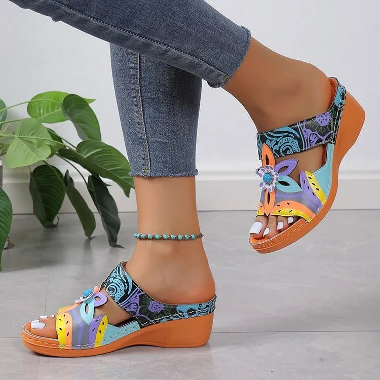 Colourful ethnic pattern women's slip-on sandals with cowhide upper and rubber sole in multiple colour options.