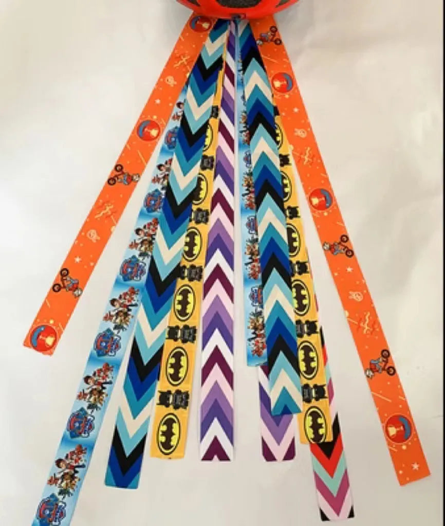 A colourful helmet streamer accessory for children's sports helmets and doll decoration.