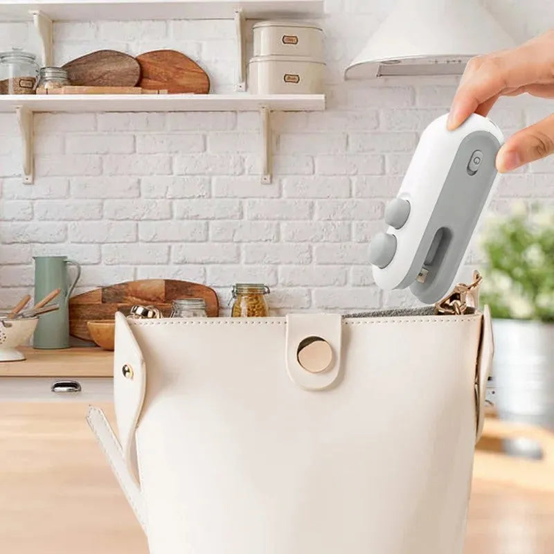 Blue handheld USB rechargeable heat sealer for sealing chip bags and food packaging
