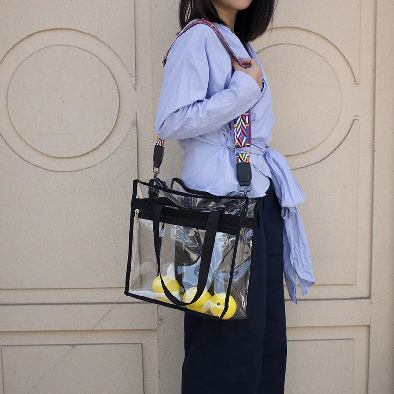 Women's transparent PVC shoulder messenger bag with double connector straps in horizontal square shape