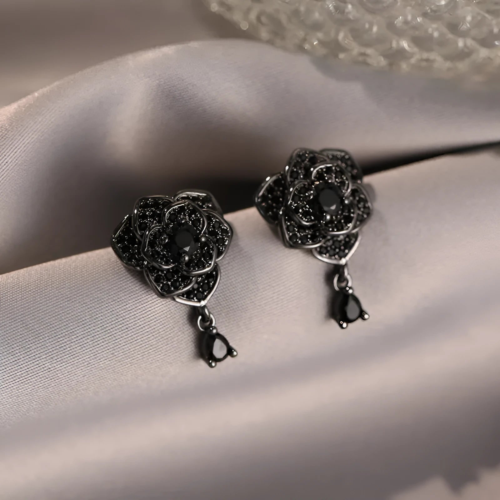 Women's rose gold plated flower ear studs with black zircon stones