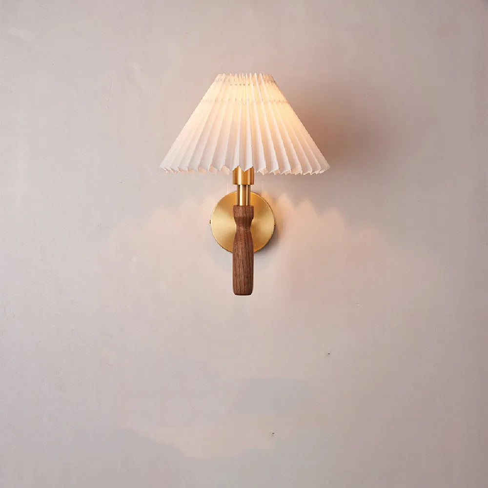 American retro style adjustable wall lamp in walnut wood with a fabric shade, mounted beside a bed.