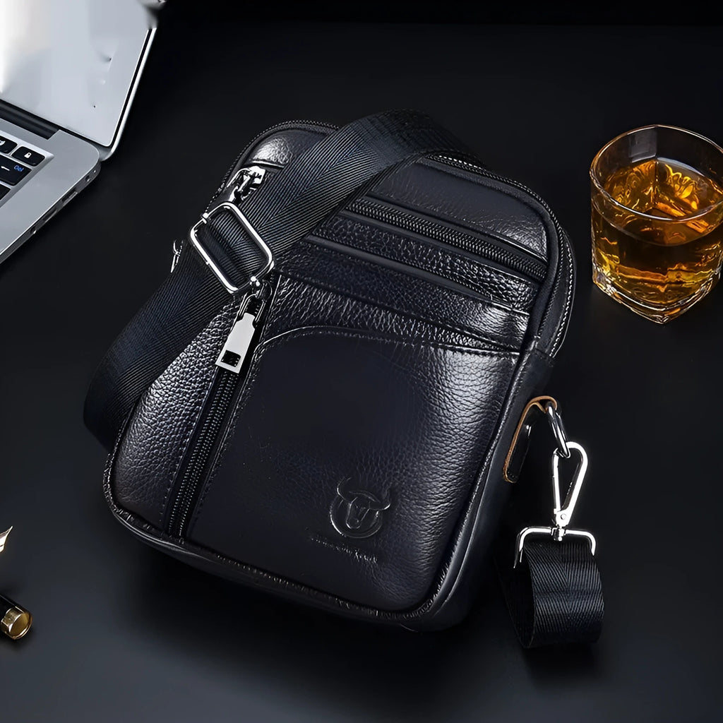 Black genuine leather men's shoulder messenger bag with retro styling on solid background
