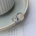 Copper vintage ring with adjustable opening and U-shaped design in white chalcedony colour