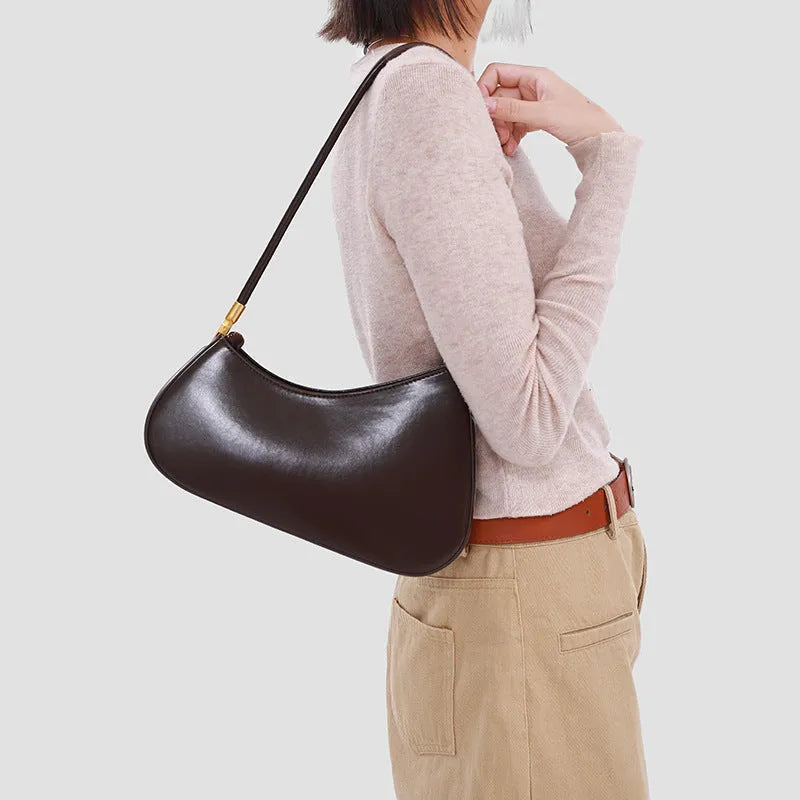 Women's oval retro underarm handbag in PU leather, shown in one of seven colours with a single strap and sewing line detail.