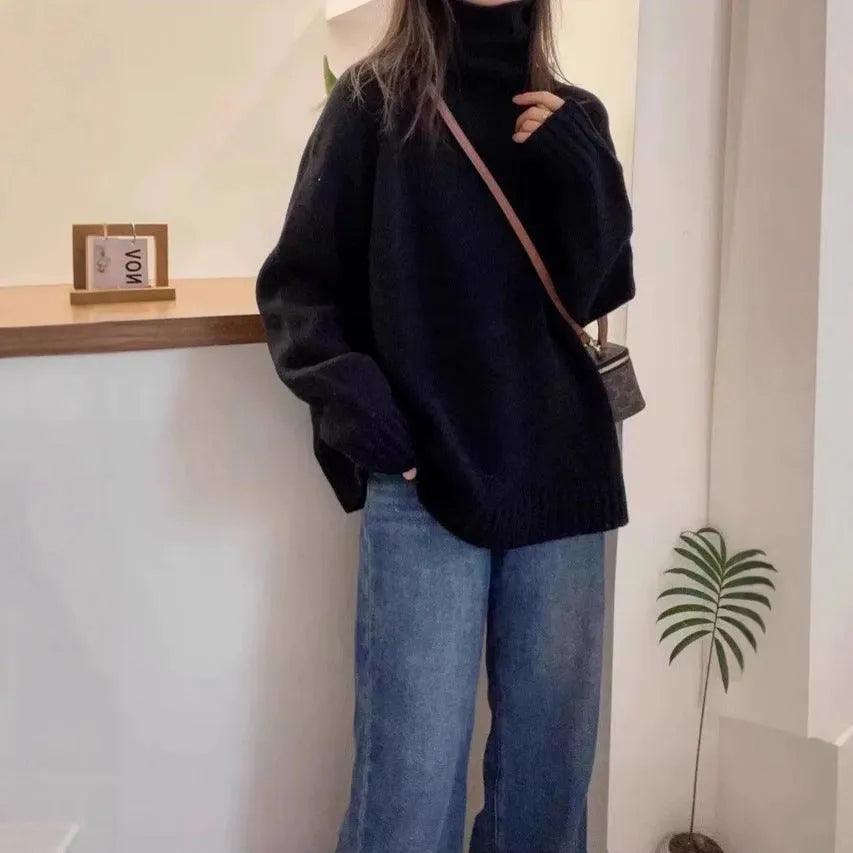 Women's thick loose-fit turtleneck sweater with curling pile collar in red, camel, grey, or black.